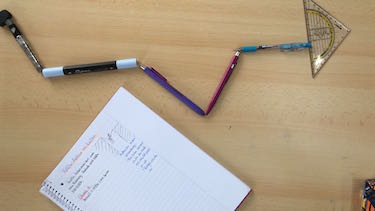 Addition von Vektoren am Beispiel von Stiften.